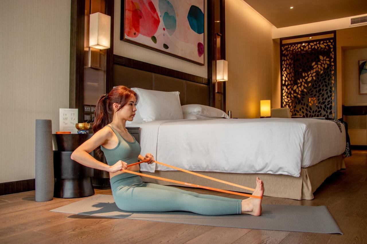 Banyan Tree Kuala Lumpur Hotel Exterior photo A woman using a resistance band